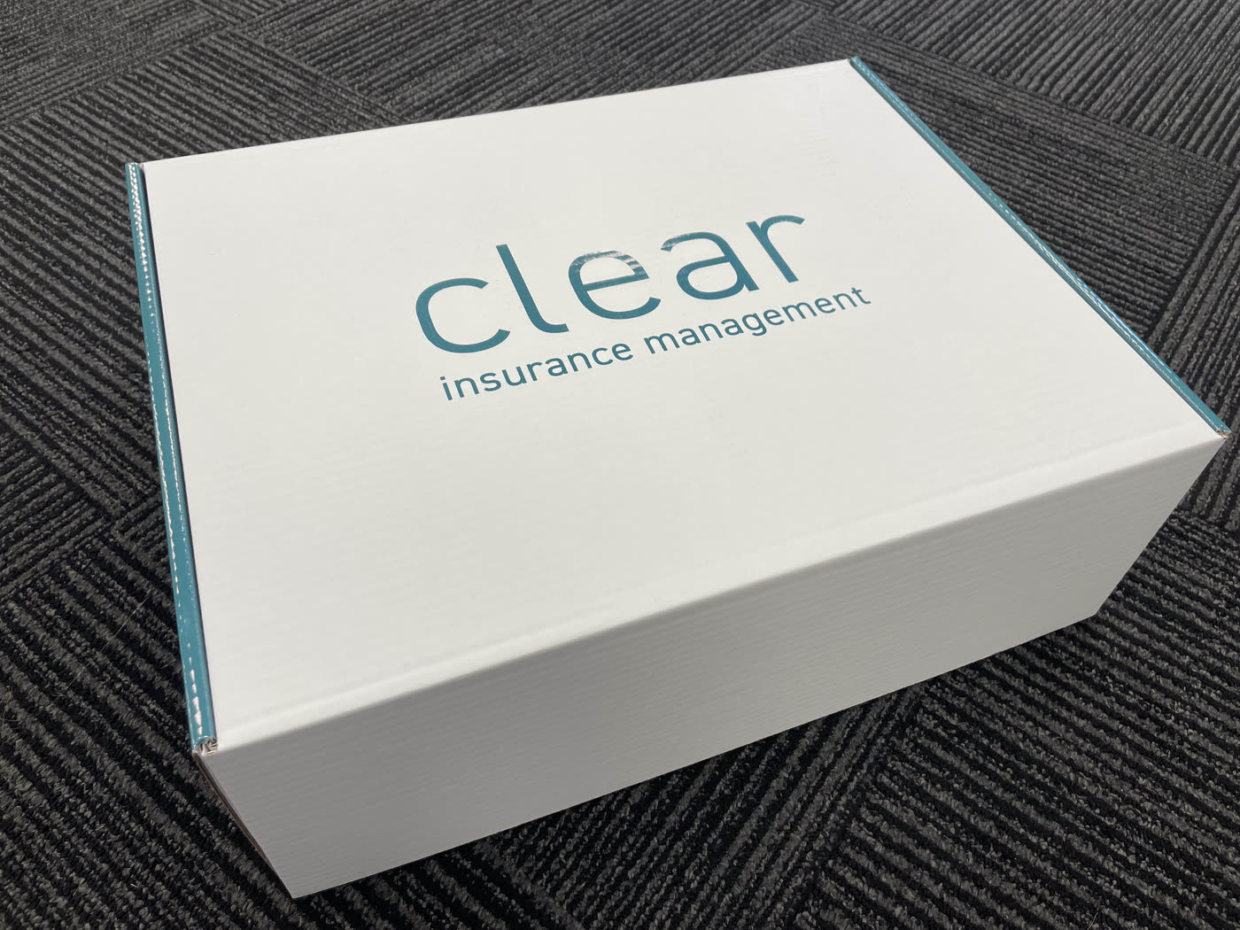 A bespoke welcome box printed in a customer's brand colours
