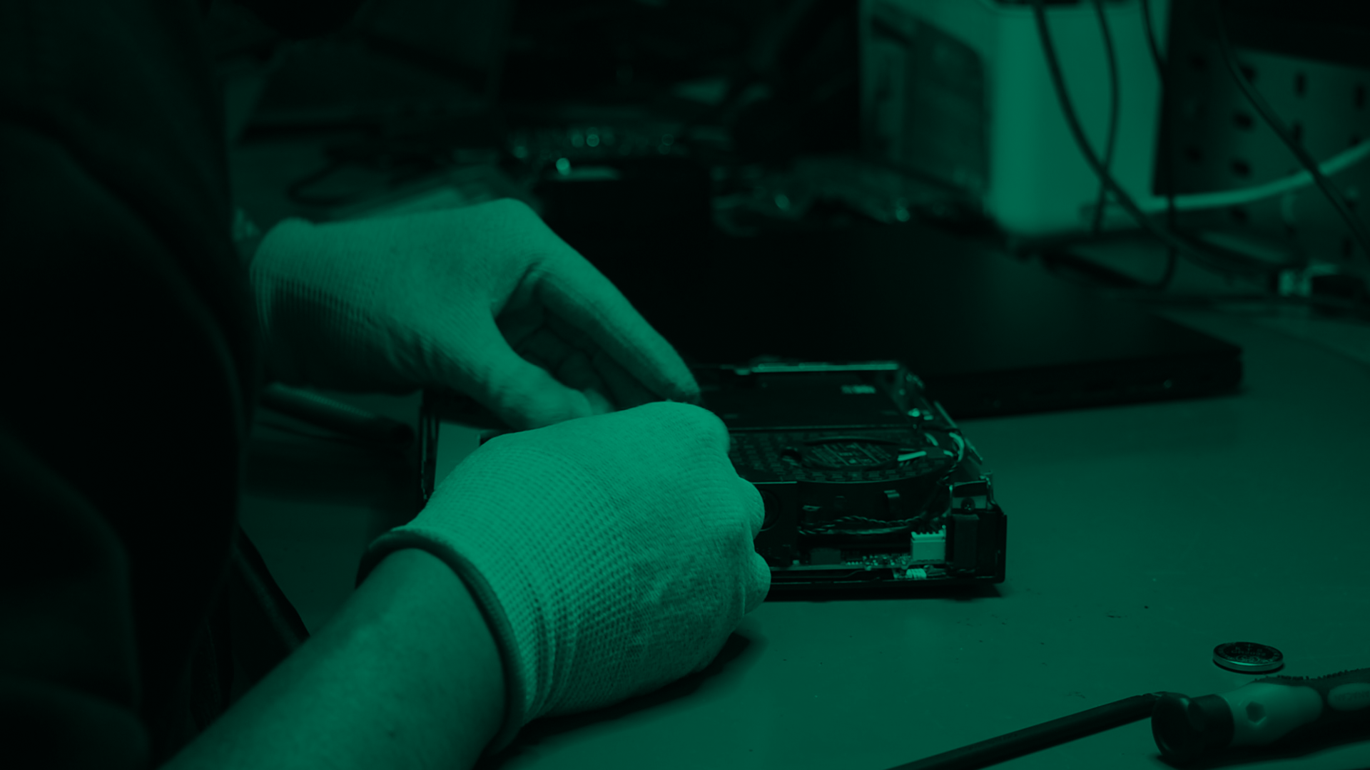 A Greensafe technician working on IT equipment for reuse
